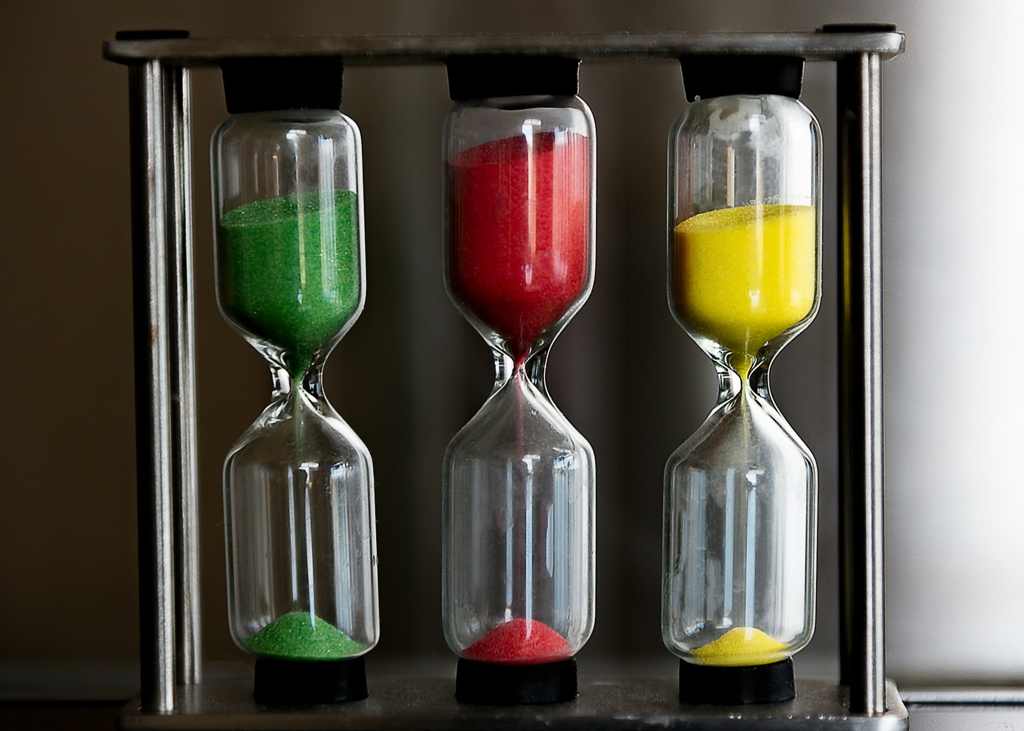 Close up of a colorful hourglass timers, green red and yellow